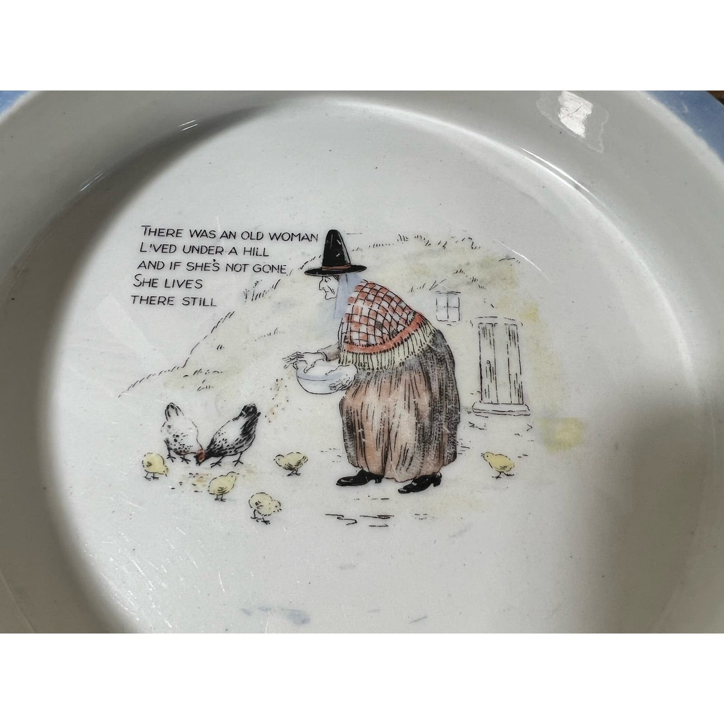 “There was an old woman who lived under a hill” porcelain child’s feeding dish