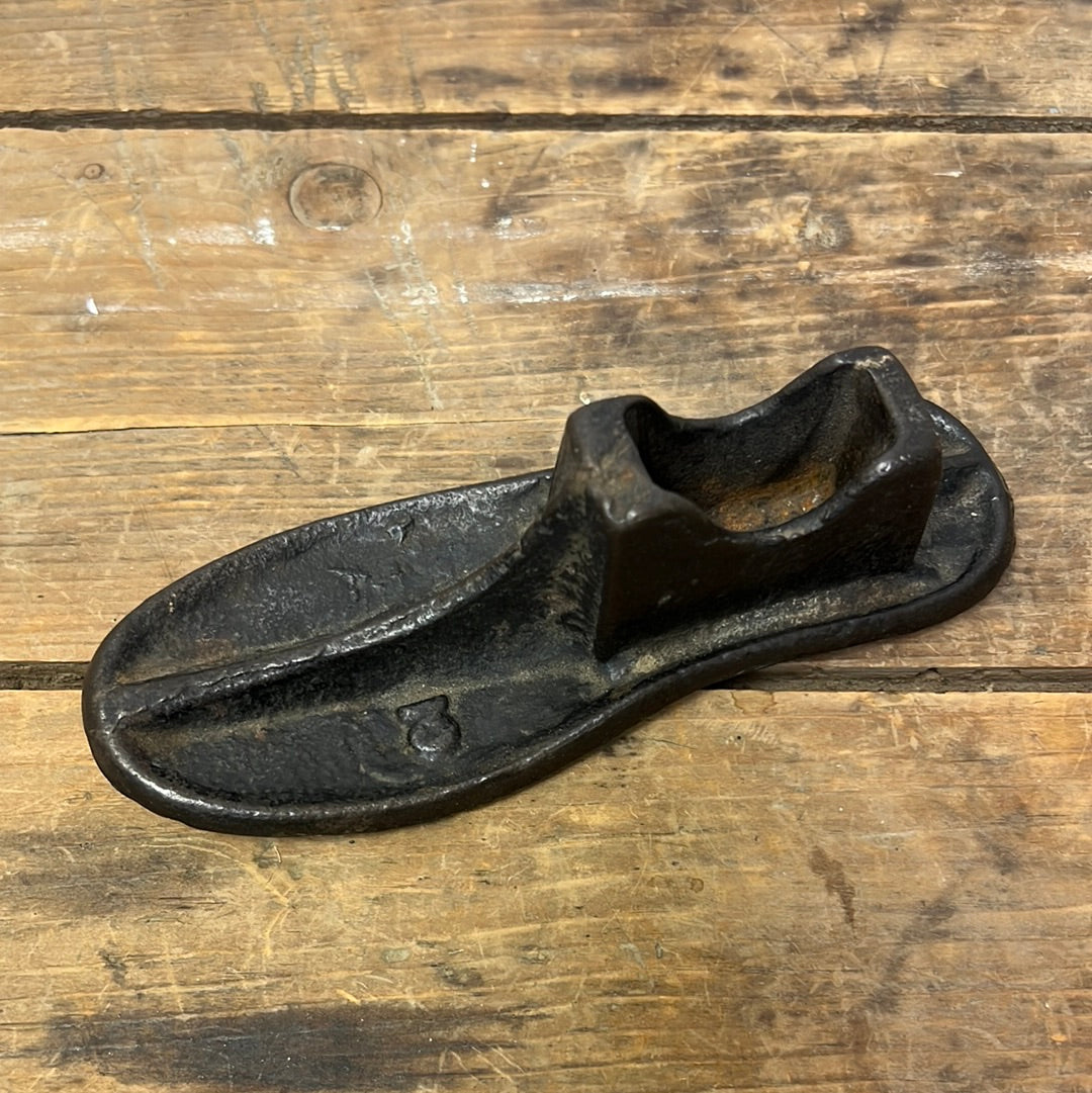 adorable vintage cast iron child size shoe form/ farmhouse decor