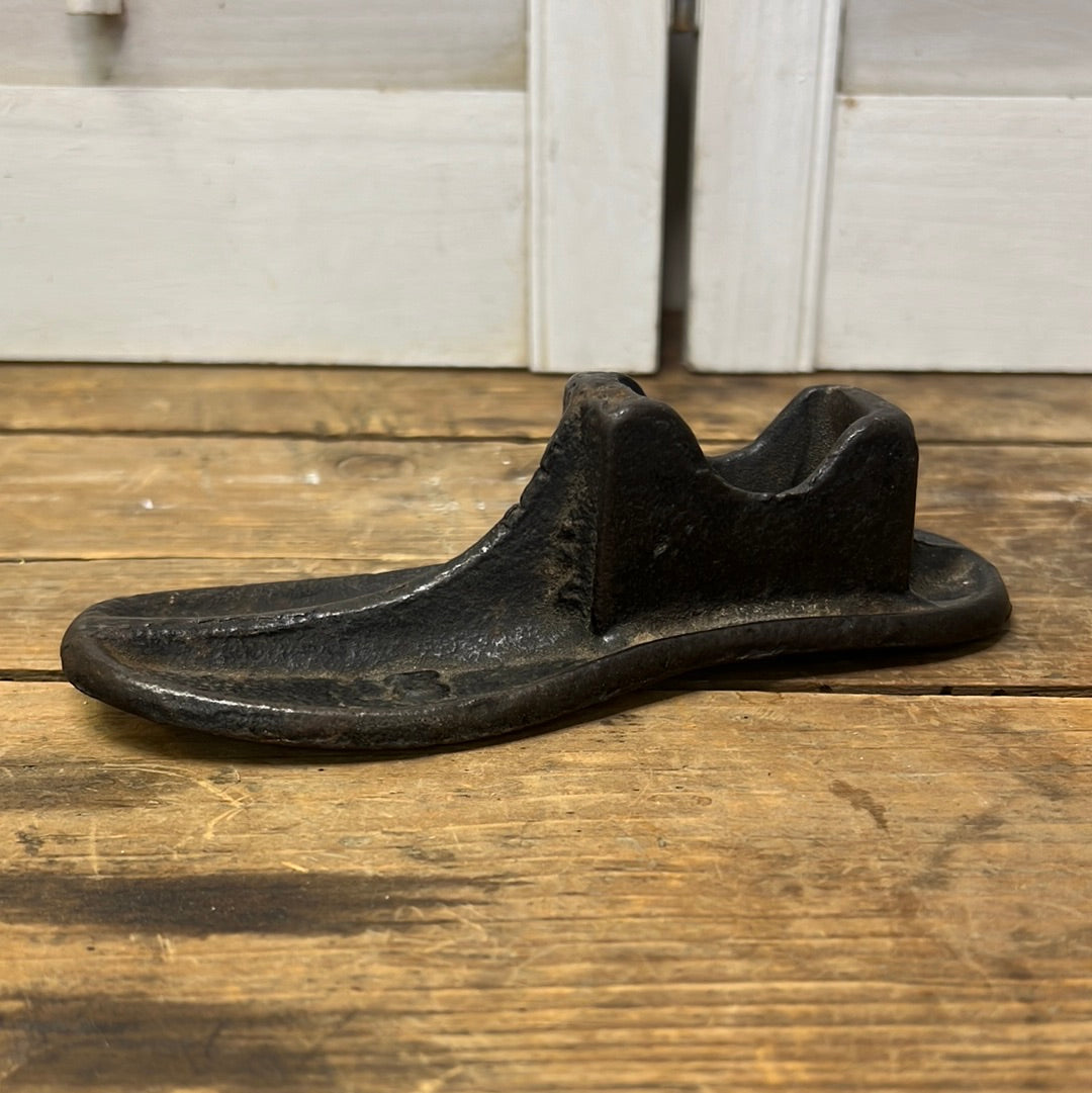 adorable vintage cast iron child size shoe form/ farmhouse decor