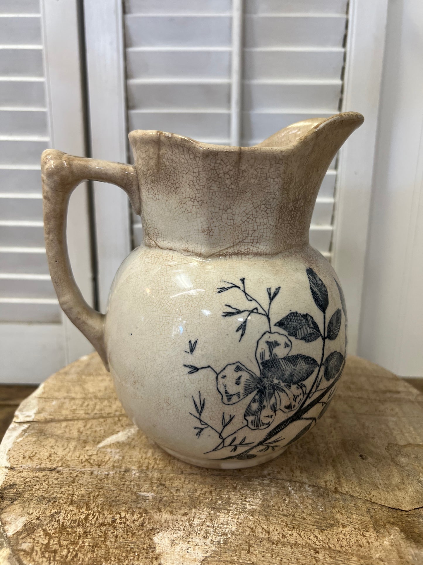 Antique English ironstone blue transferware floral stained and crazed milk pitcher
