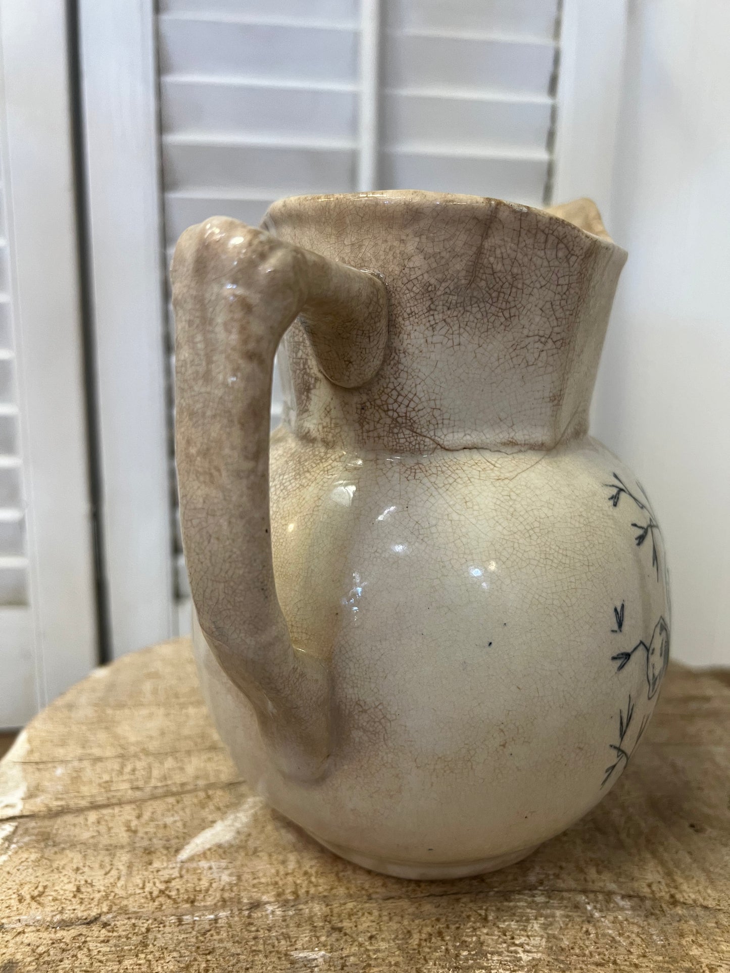 Antique English ironstone blue transferware floral stained and crazed milk pitcher