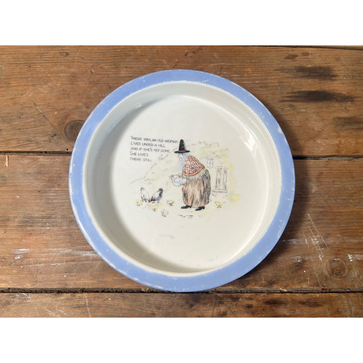 “There was an old woman who lived under a hill” porcelain child’s feeding dish