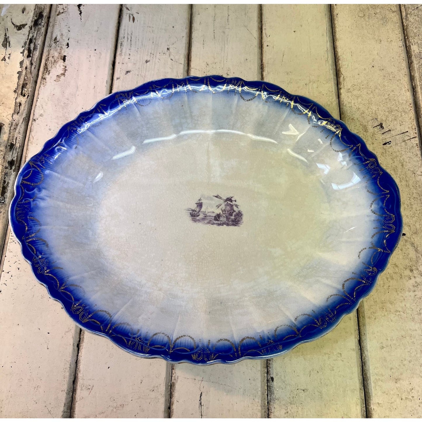 Antique Flow Blue platter with transfer design in center