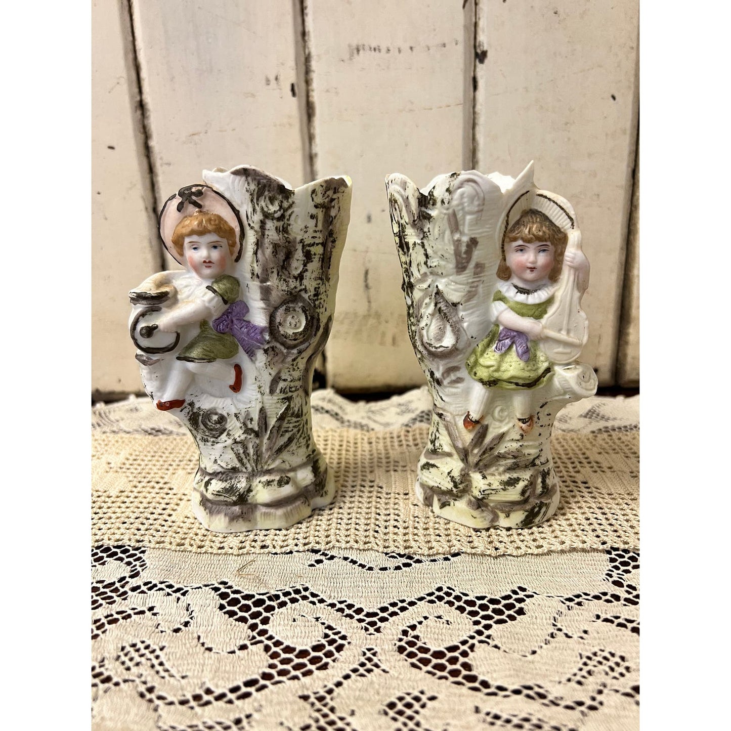 Antique hand painted porcelain pair of vases