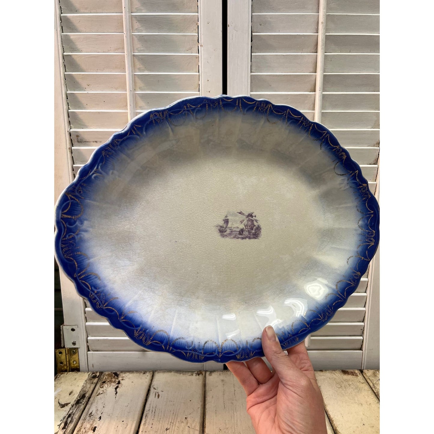 Antique Flow Blue platter with transfer design in center