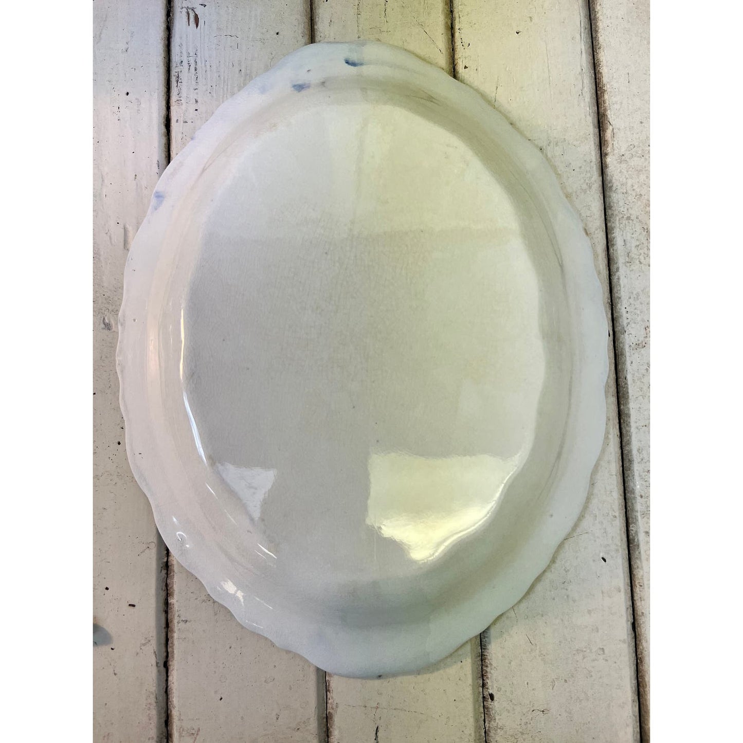 Antique Flow Blue platter with transfer design in center
