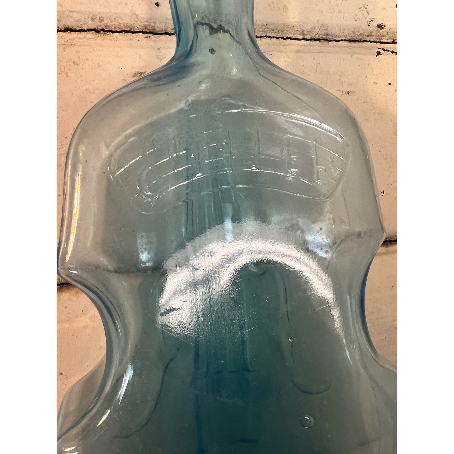 Vintage blue glass violin bottle