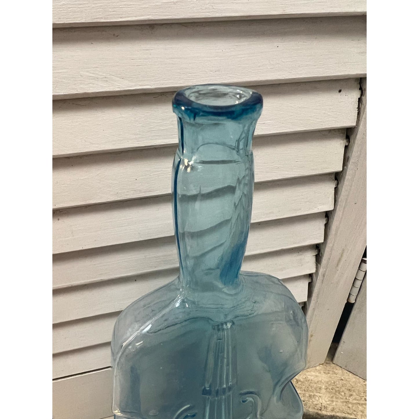 Vintage blue glass violin bottle