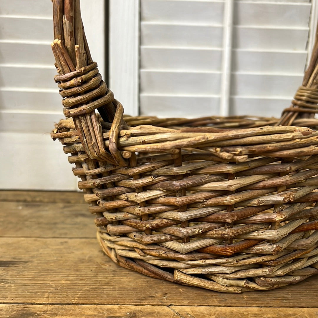 Grapevine woven basket with tall handle