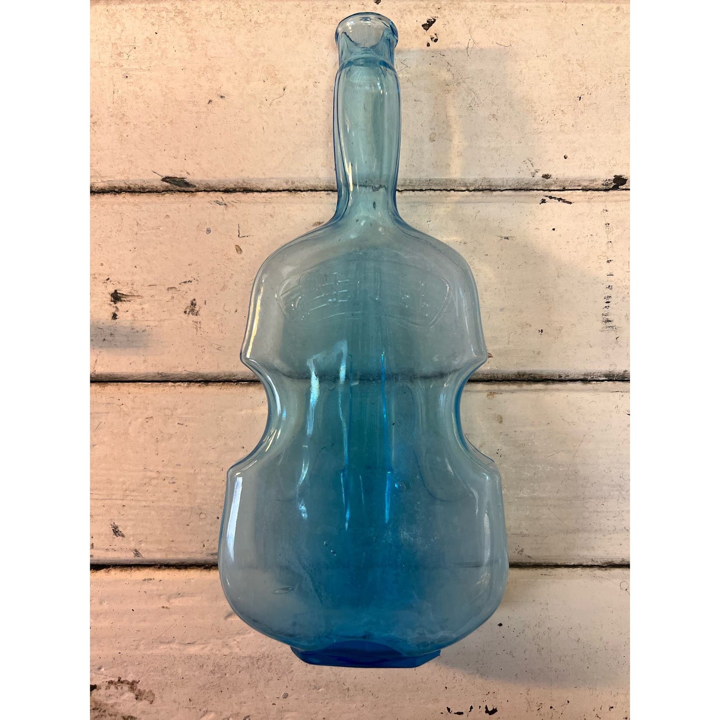 Vintage blue glass violin bottle