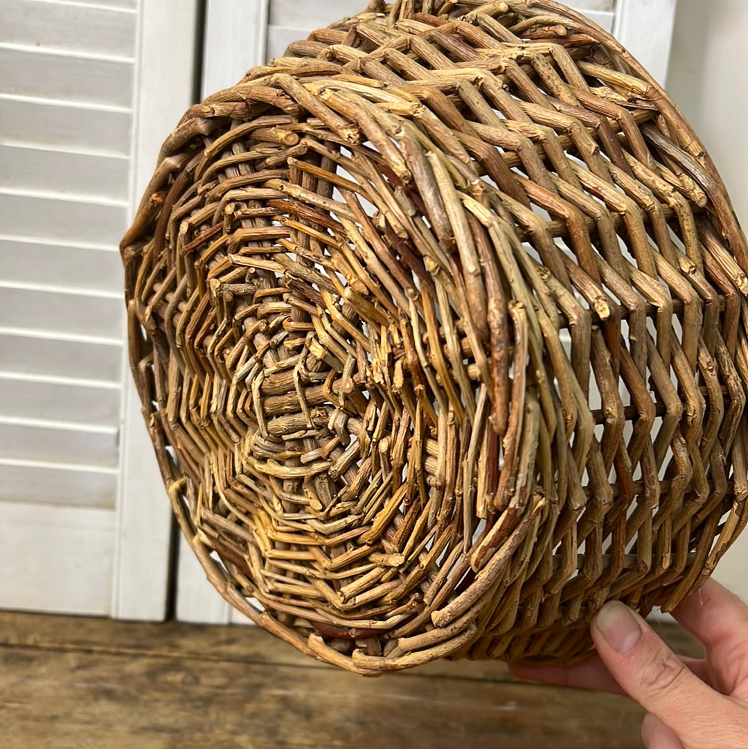 Grapevine woven basket with tall handle