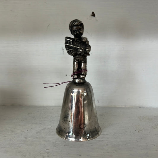 Reed and Barron Silverplate Bell with little boy holding train