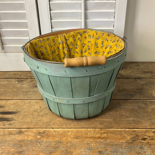 Small blue/green fruit basket with yellow floral fabric liner