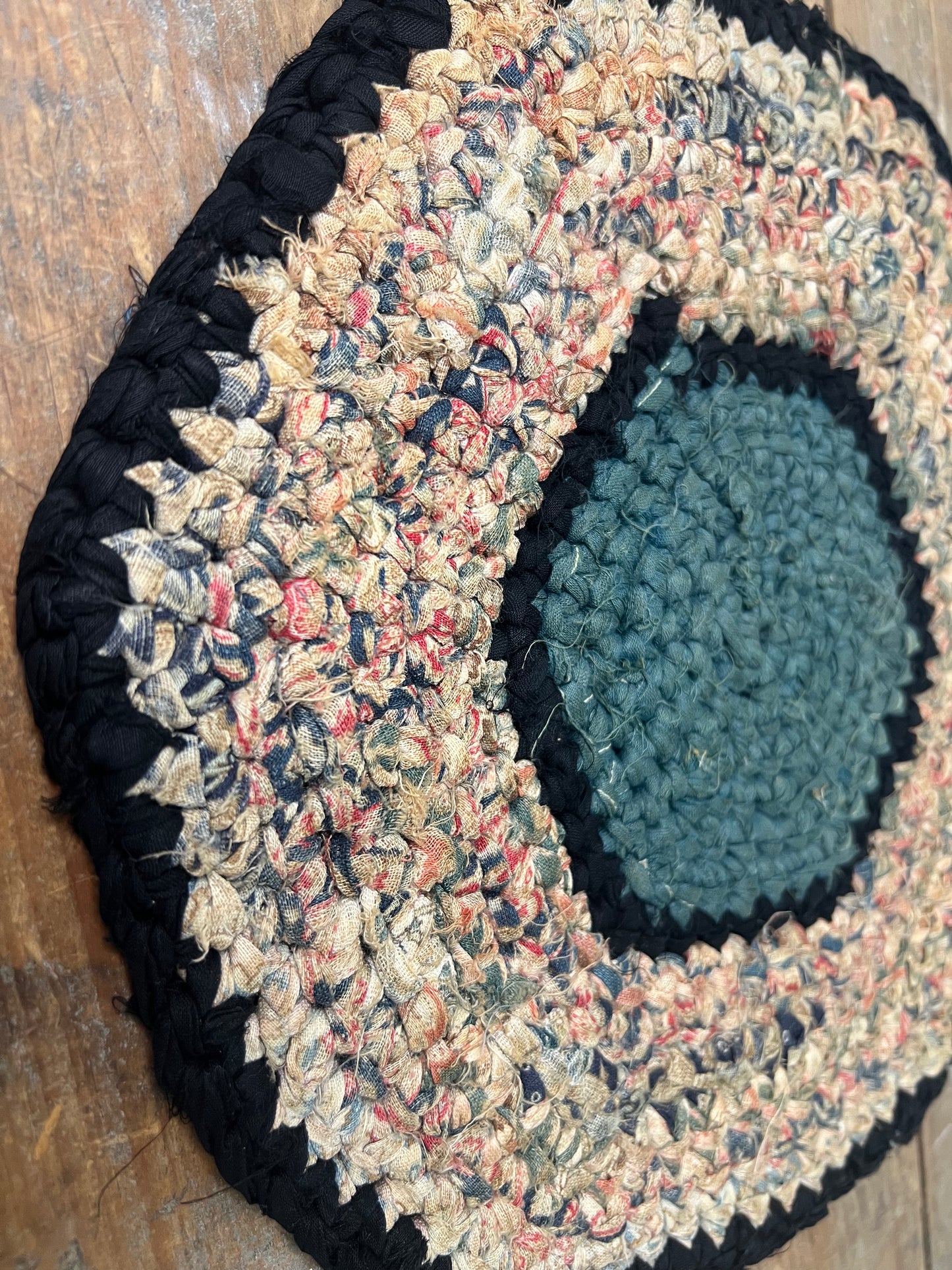 Antique braided table mat
