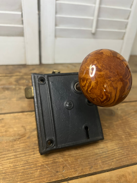 Antique mid-late 1800’s mortise lock mechanism with two matching marbled porcelain door knobs
