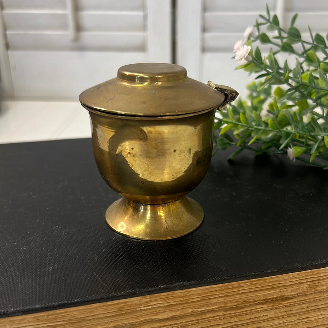 Small brass candleholder with flip top