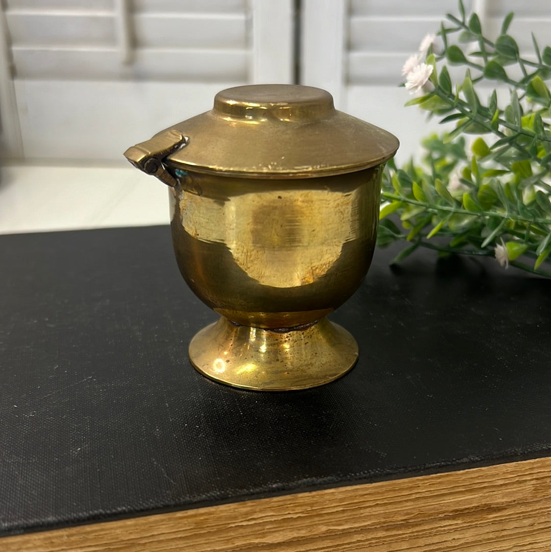 Small brass candleholder with flip top