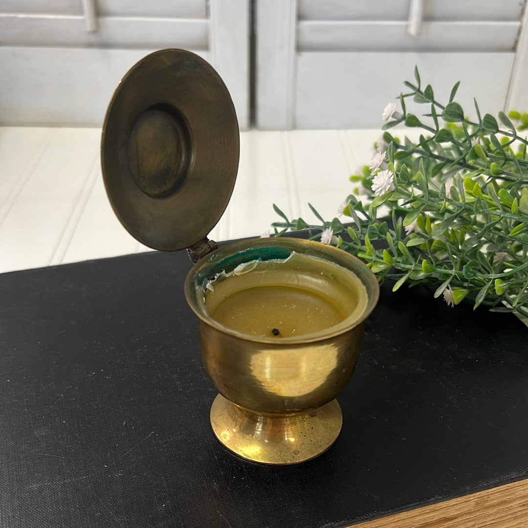 Small brass candleholder with flip top