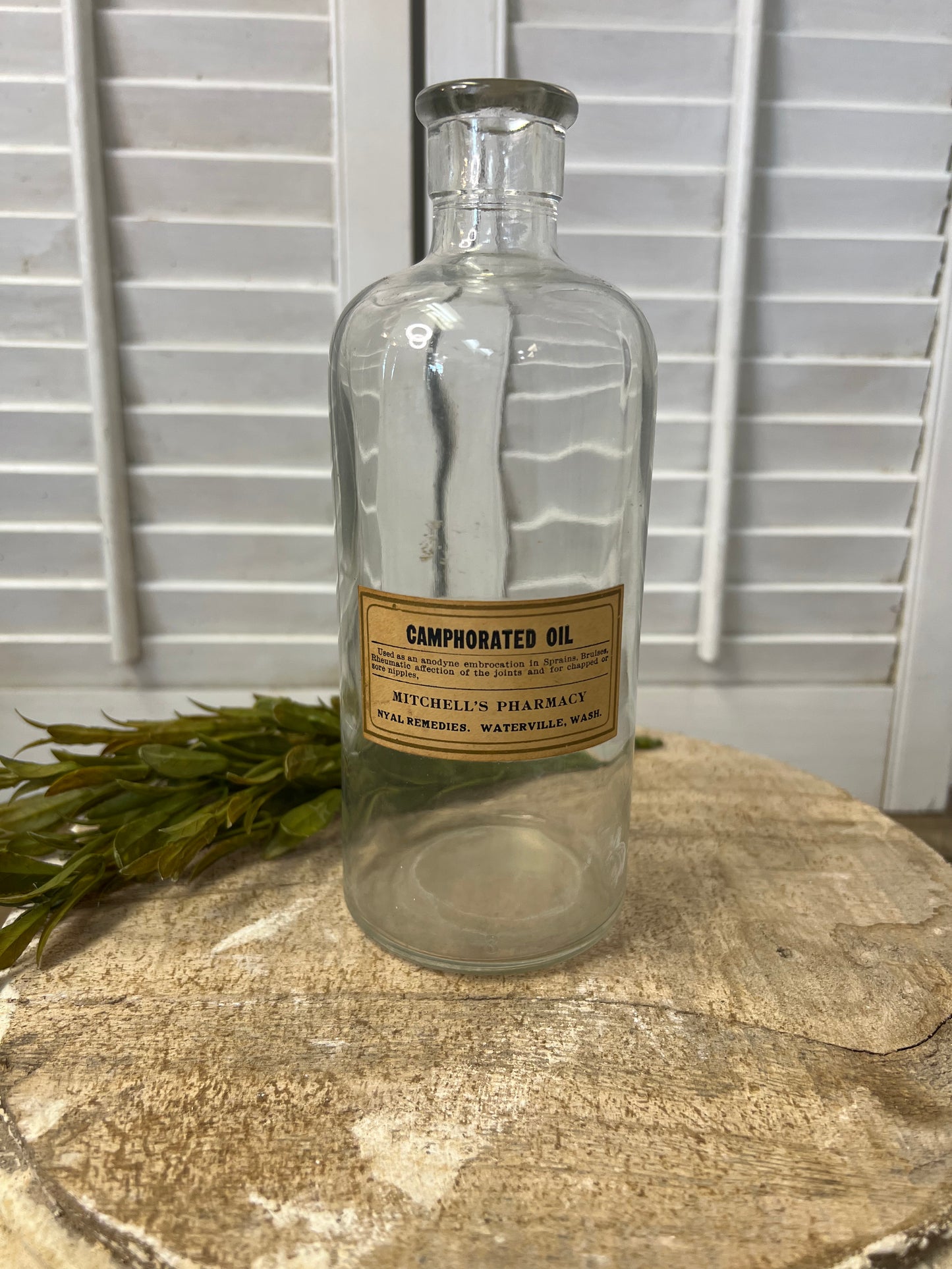 Antique apothecary bottle with original label