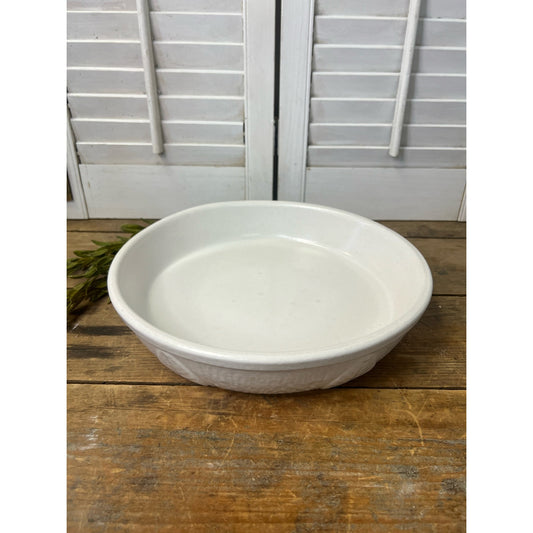 Vintage white glazed 10” plate 
with leaf pattern made in USA