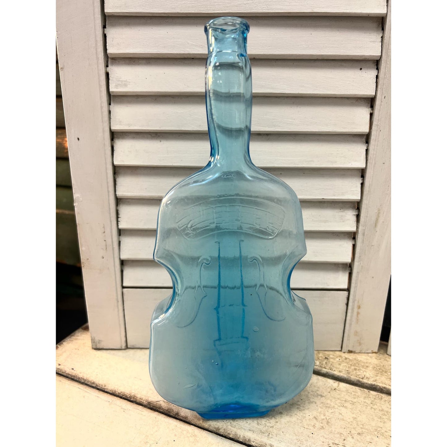 Vintage blue glass violin bottle