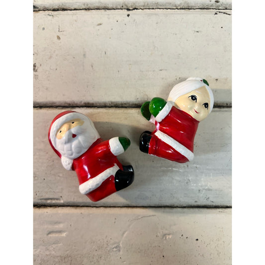 Vintage ceramic Santa and Mrs Claus candle climbers